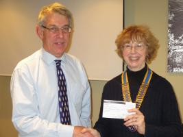 Dr Kilpatrick, of "Mercy Ships" receives a cheque from Pres. Annabel King.